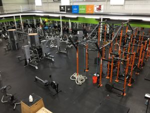 orange obstacle machine and various equipment scattered around