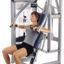 girl using a cybex vr3 chest machine