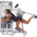 girl using a cybex vr3 glute machine